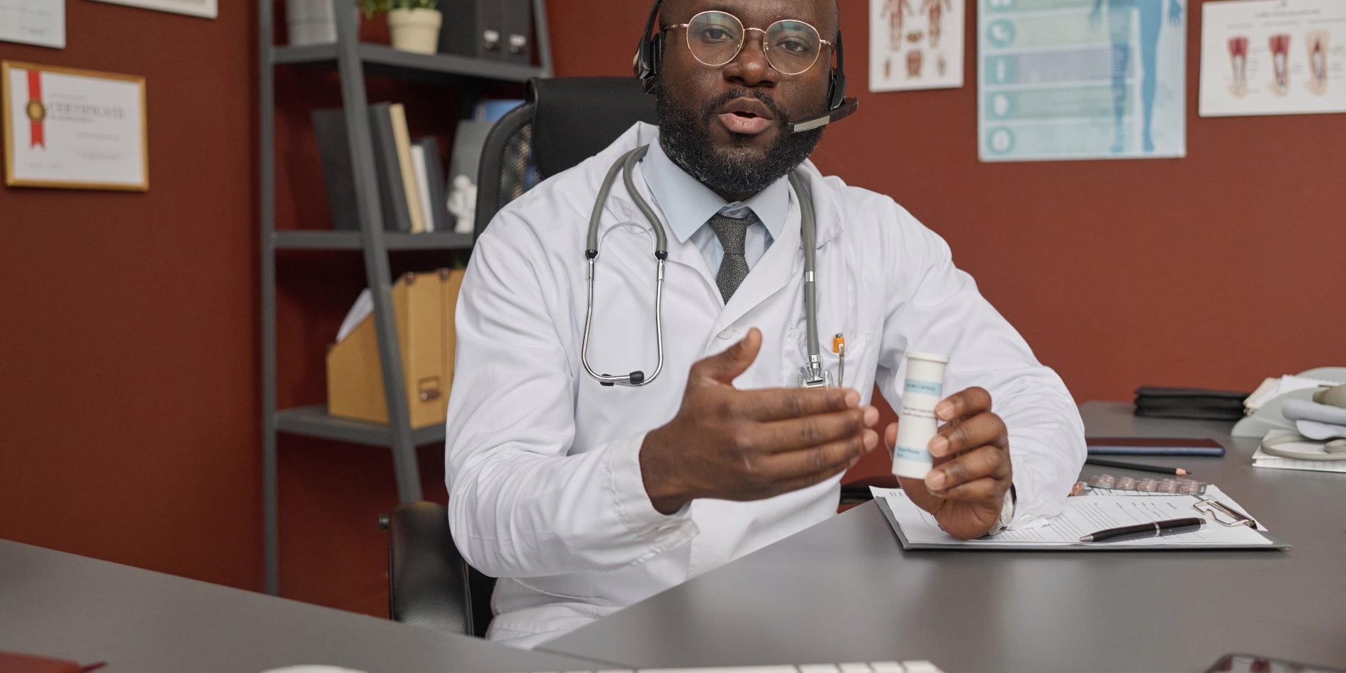 doctor-prescribing-medicine-to-his-patient-during-2024-01-29-18-25-16-utc (1)